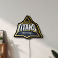 Unlit Gujarat Titans LED lightbox mounted on a wall in daylight
