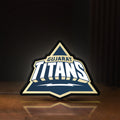 Front view of Gujarat Titans LED lightbox sign glowing on a wooden desk
