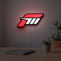 Forza Motorsport 3 LED lightbox hanging on a room wall with soft red light