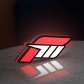 Forza Motorsport 3 LED lightbox standing on a desk from an angled side view with red glow