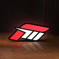 Front view of Forza Motorsport 3 LED lightbox sign glowing on a wooden desk