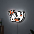 Cuphead LED lightbox hanging on a wall with white glow