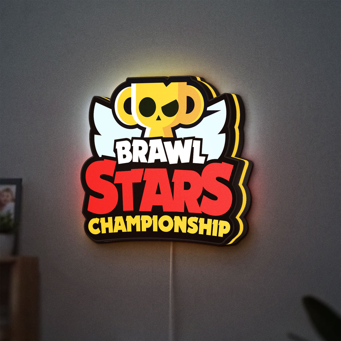 Brawl Stars Championship Lightbox LED lightbox hanging on a wall with yellow glow