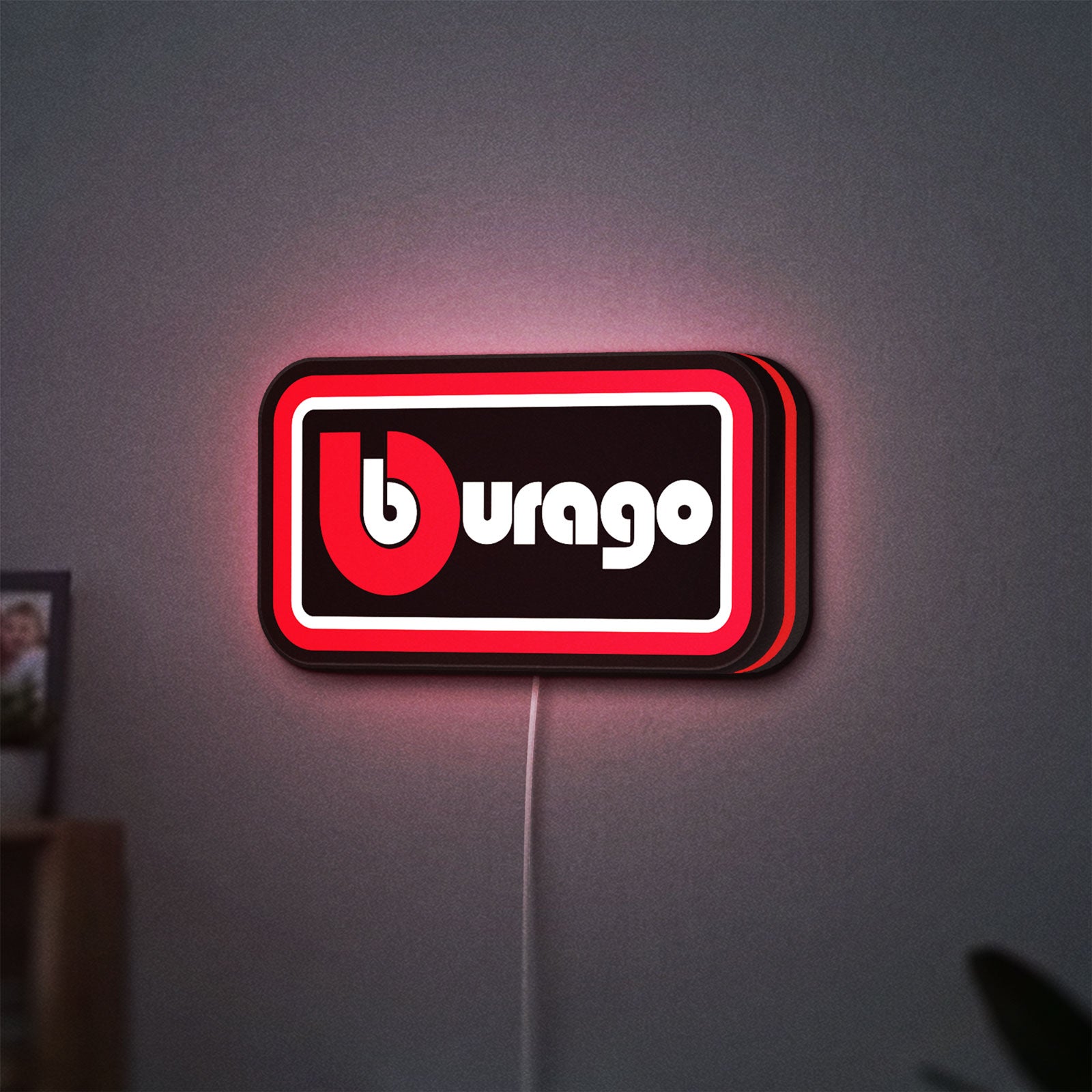 Bburago LED lightbox hanging on a wall with red glow