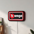 Unlit Bburago LED lightbox mounted on a wall in daylight