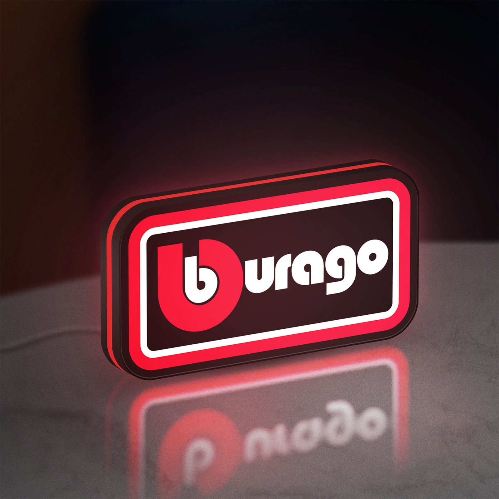Bburago LED lightbox standing on a desk from an angled side view with red glow
