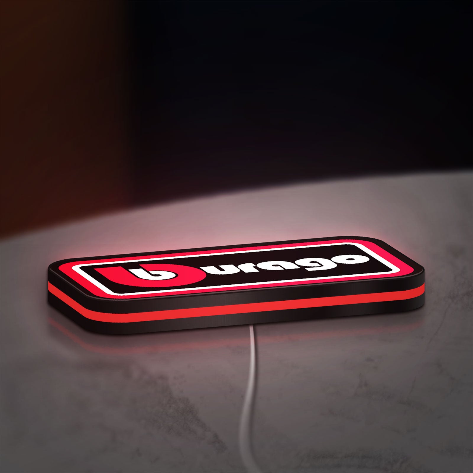 Bburago LED lightbox lying flat on a desk with red glow