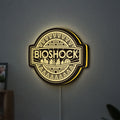BioShock Rapture City LED lightbox hanging on a wall with yellow glow