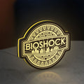 BioShock Rapture City LED lightbox standing on a desk from an angled side view with yellow glow