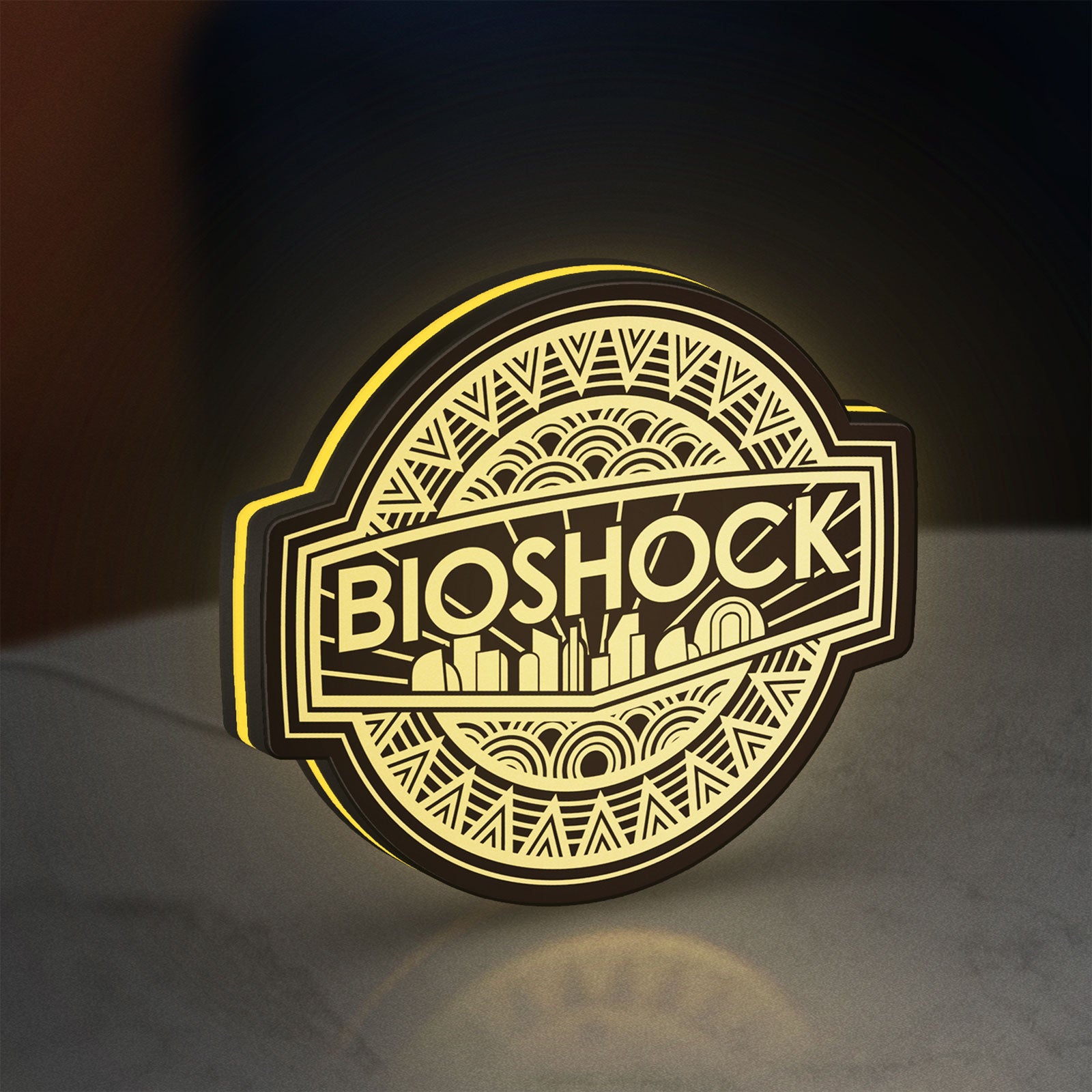 BioShock Rapture City LED lightbox standing on a desk from an angled side view with yellow glow