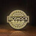 Front view of BioShock Rapture City LED lightbox sign glowing on a wooden desk