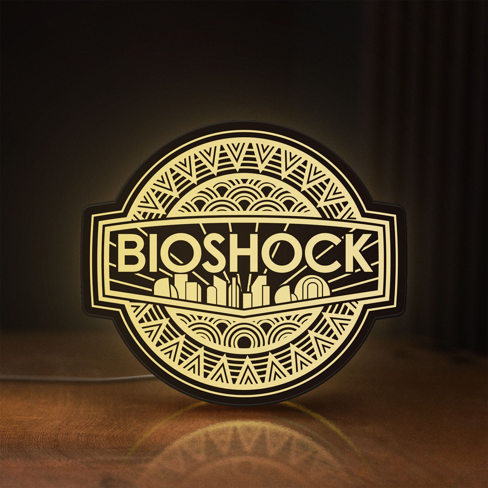 Front view of BioShock Rapture City LED lightbox sign glowing on a wooden desk