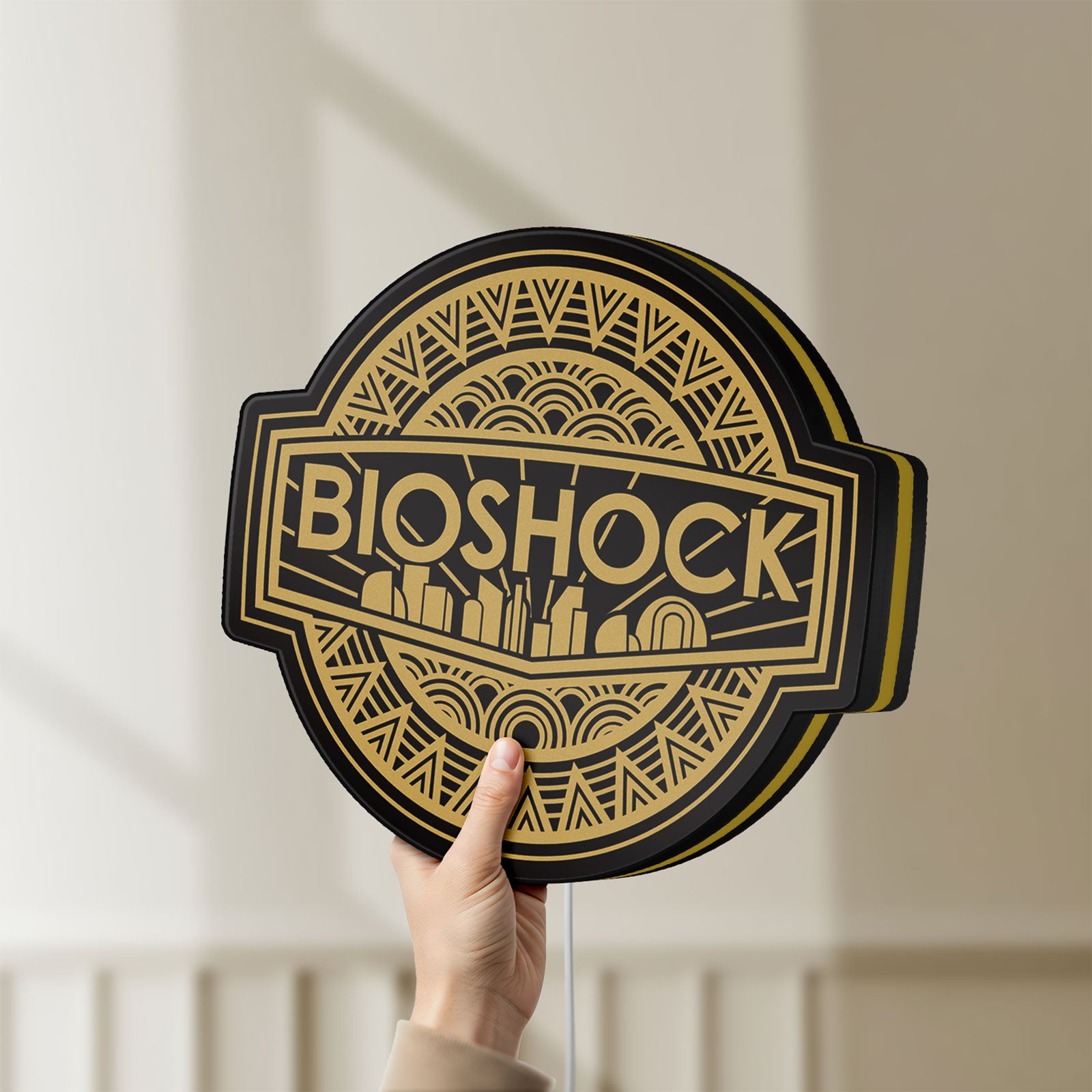 Unlit BioShock Rapture City LED lightbox held by hand to show size and details