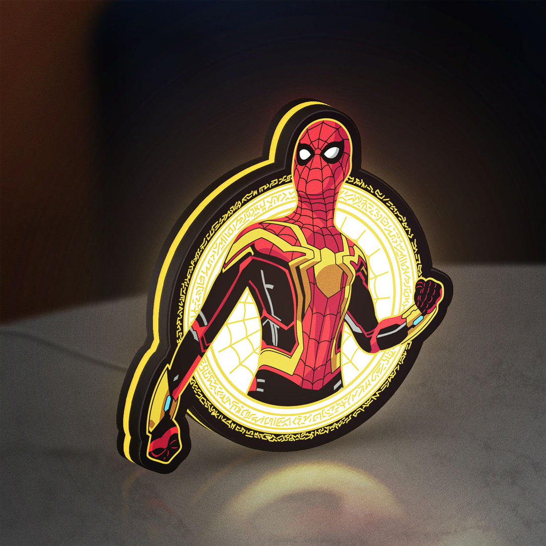 Spiderman LED lightbox hanging on a wall with yellow glow
