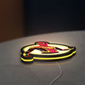 Spiderman LED lightbox lying flat on a desk with yellow glow