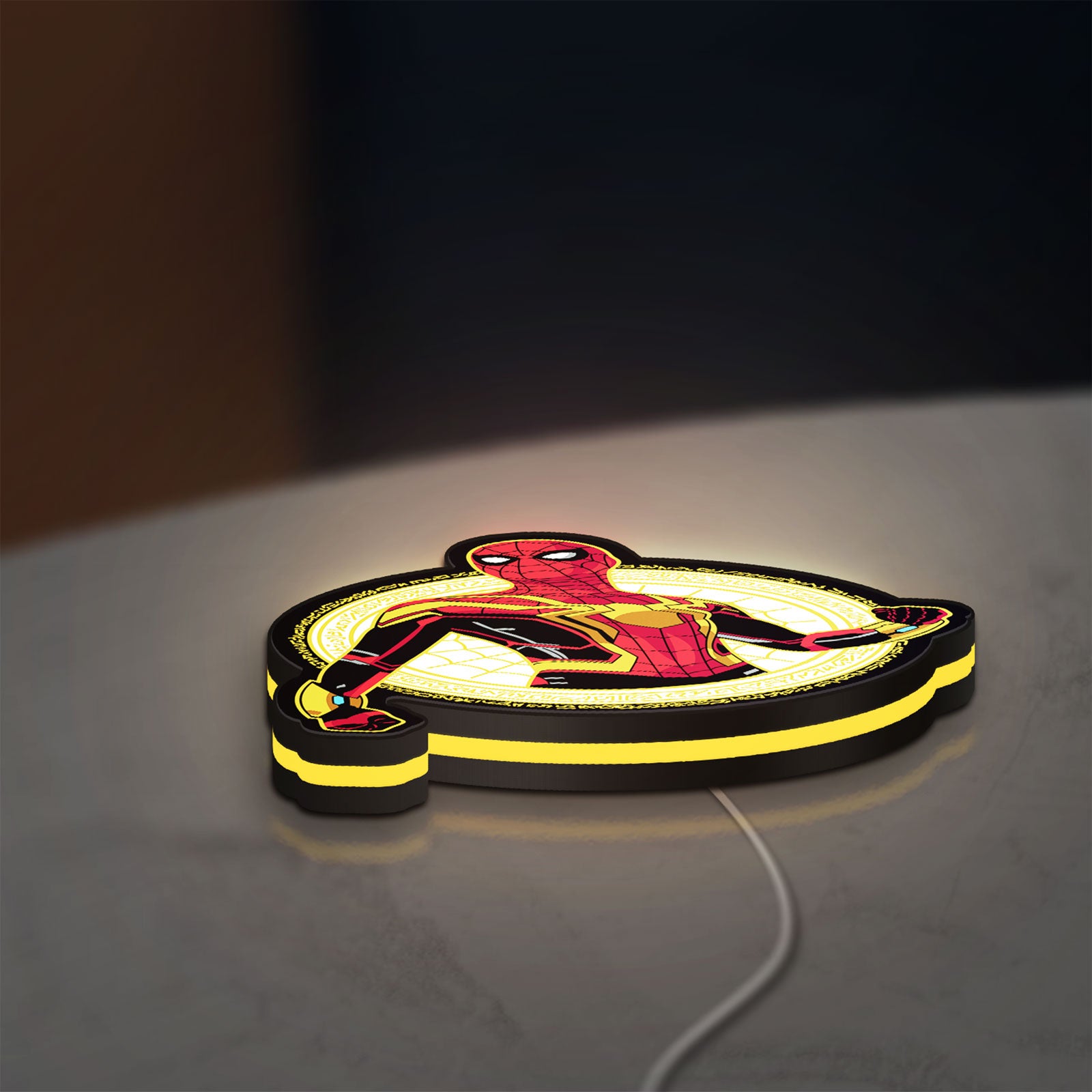 Spiderman LED lightbox lying flat on a desk with yellow glow