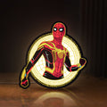 Front view of Spiderman LED lightbox sign glowing on a wooden desk