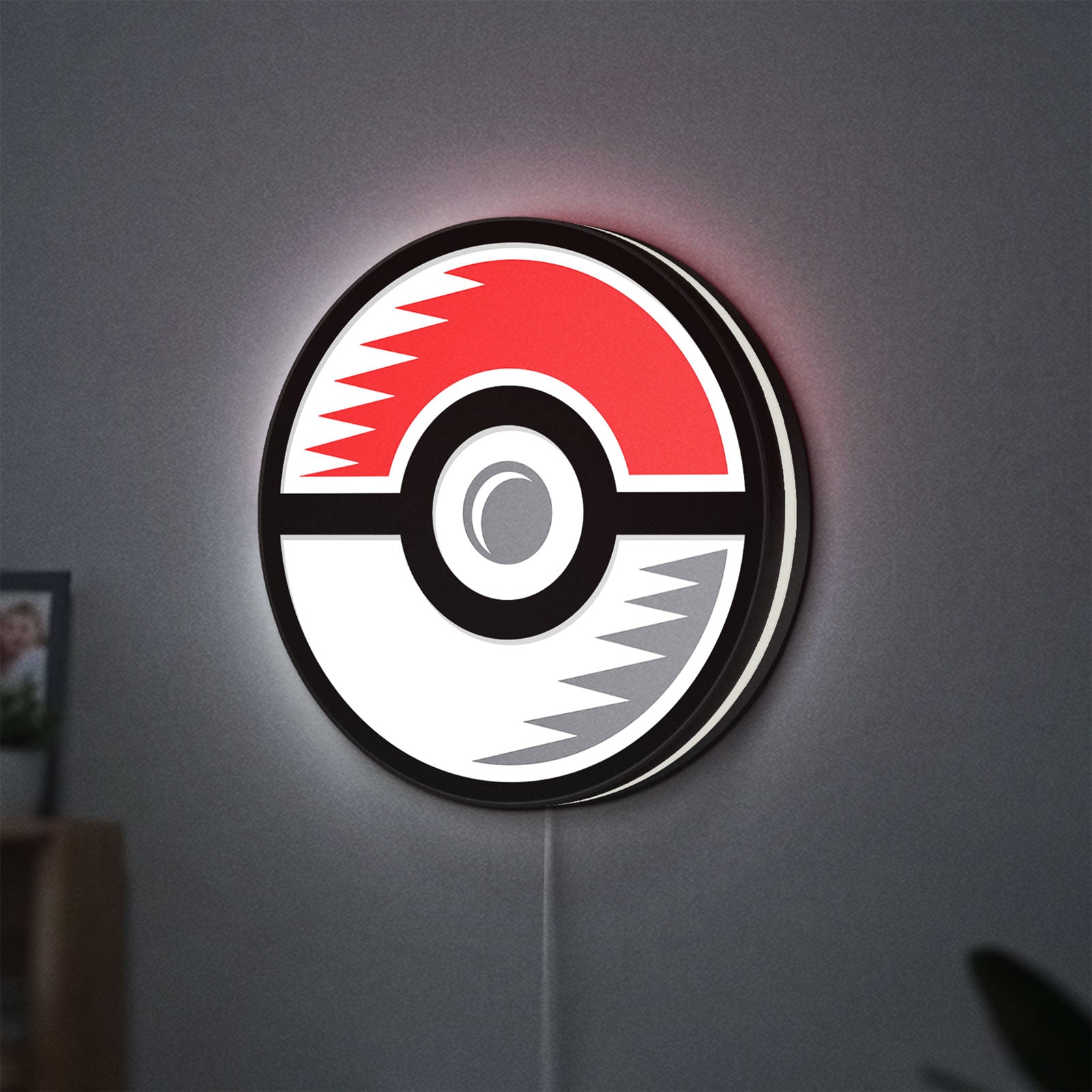 Pokémon Pokéball Legue LED lightbox hanging on a wall with white glow