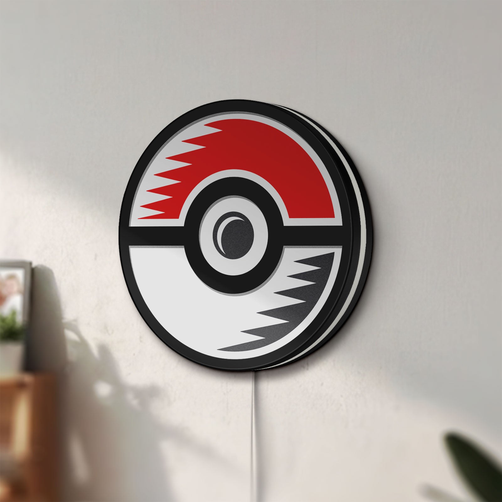 Unlit Pokémon Pokéball Legue LED lightbox mounted on a wall in daylight