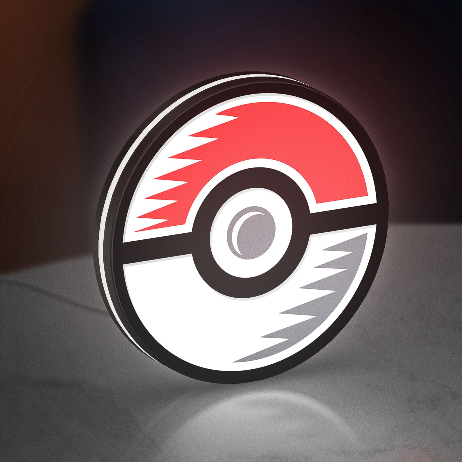 Pokémon Pokéball Legue LED lightbox standing on a desk from an angled side view with white glow