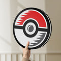 Unlit Pokémon Pokéball Legue LED lightbox held by hand to show size and details