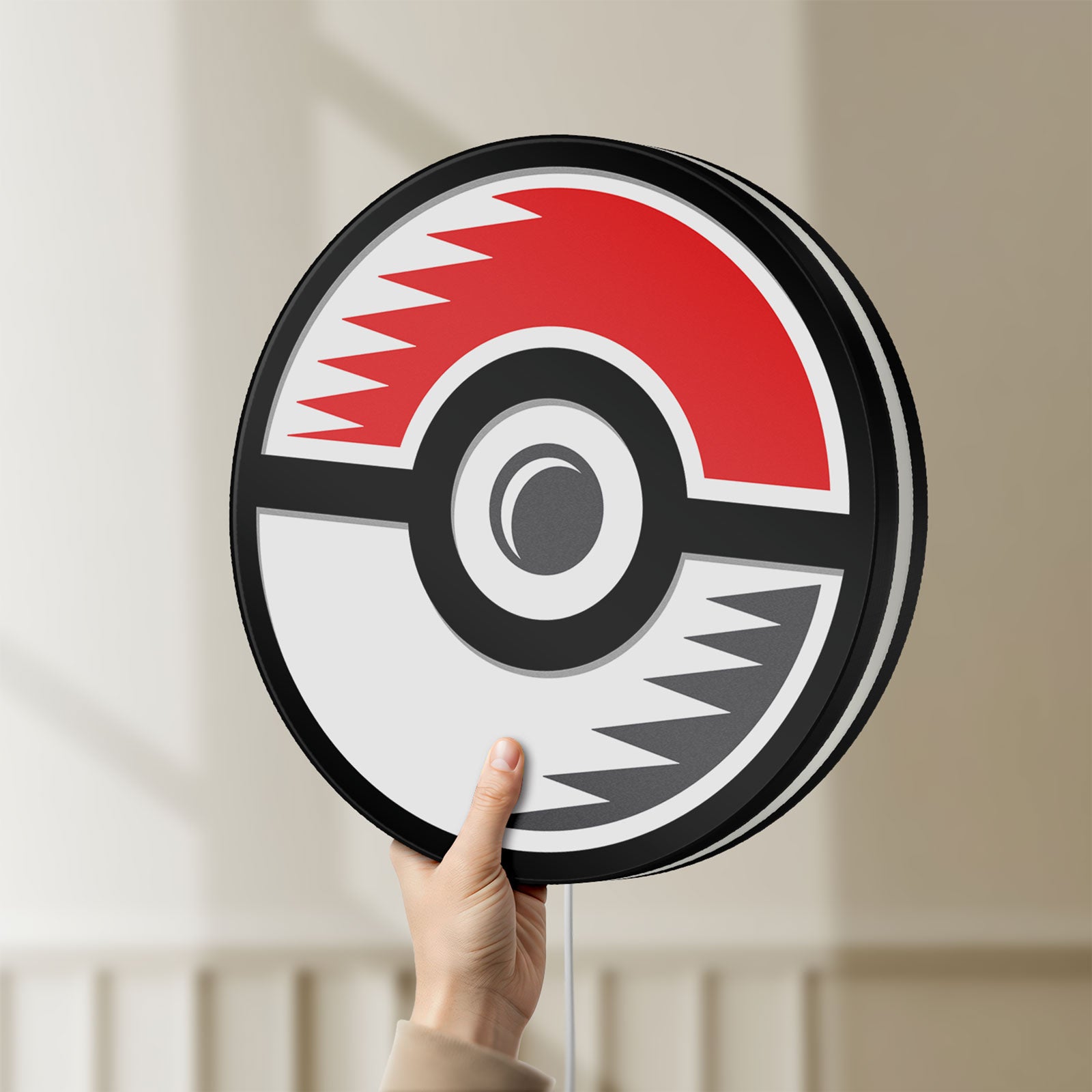 Unlit Pokémon Pokéball Legue LED lightbox held by hand to show size and details
