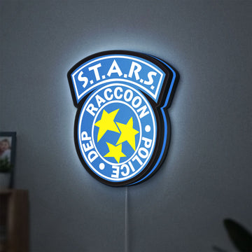 Raccoon City STARS LED lightbox hanging on a wall with blue glow
