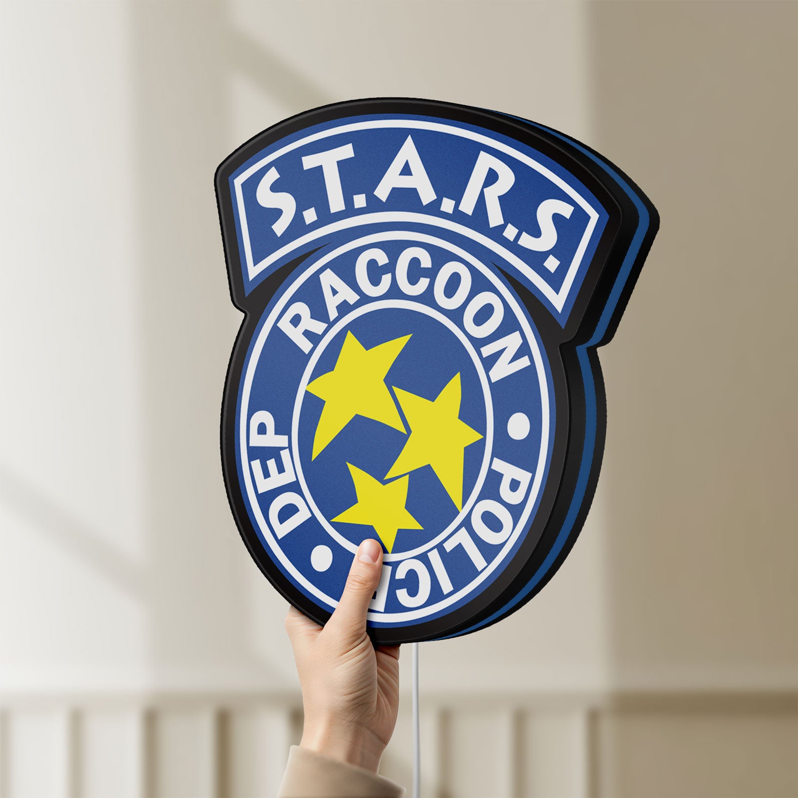 Unlit Raccoon City STARS LED lightbox held by hand to show size and details