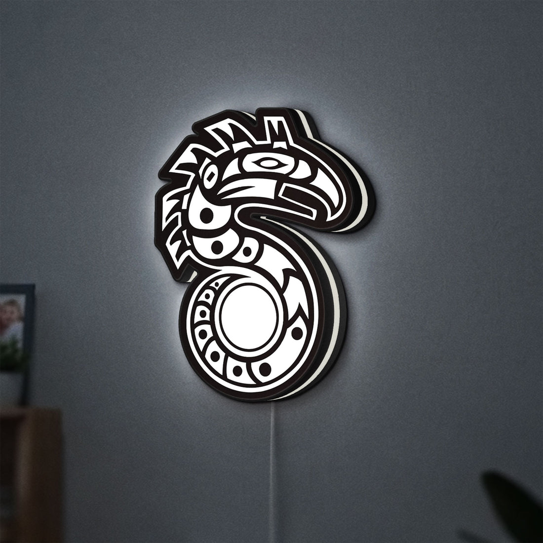 Shadowrun LED lightbox hanging on a wall with white glow