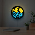 SNK NeoGeo LED lightbox hanging on a room wall with soft yellow light