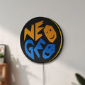 Unlit SNK NeoGeo LED lightbox mounted on a wall in daylight