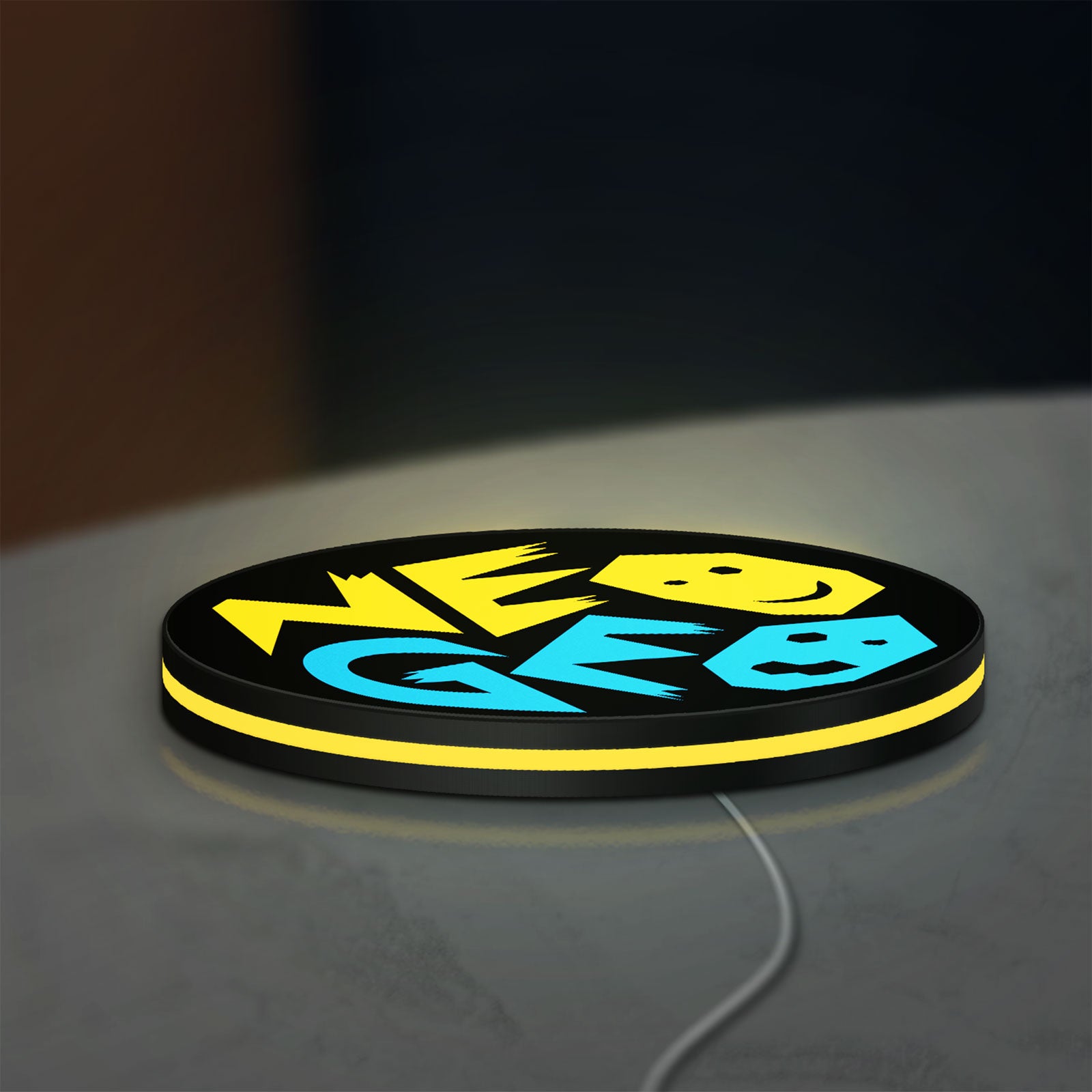 SNK NeoGeo LED lightbox lying flat on a desk with yellow glow