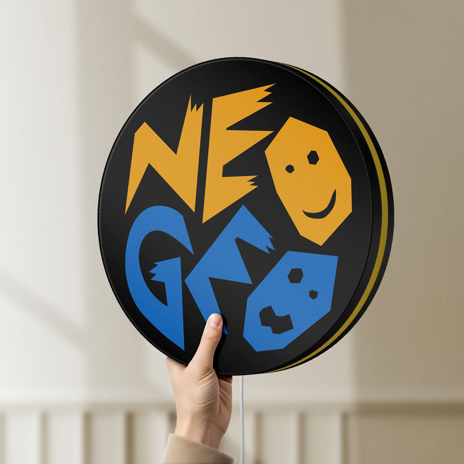Unlit SNK NeoGeo LED lightbox held by hand to show size and details
