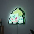 Bulbasaur LED lightbox hanging on a wall with green glow