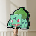 Unlit Bulbasaur LED lightbox held by hand to show size and details