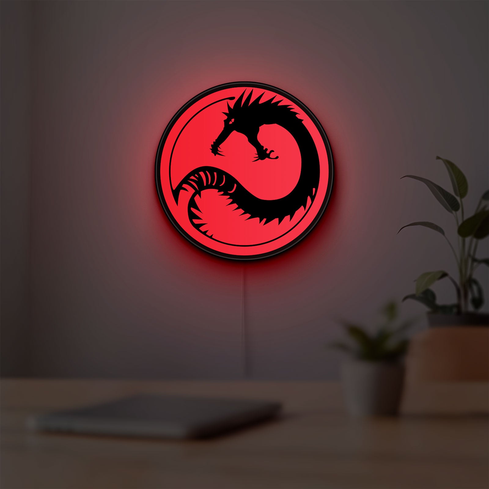 Battletech House Kurita LED lightbox hanging on a room wall with soft red light