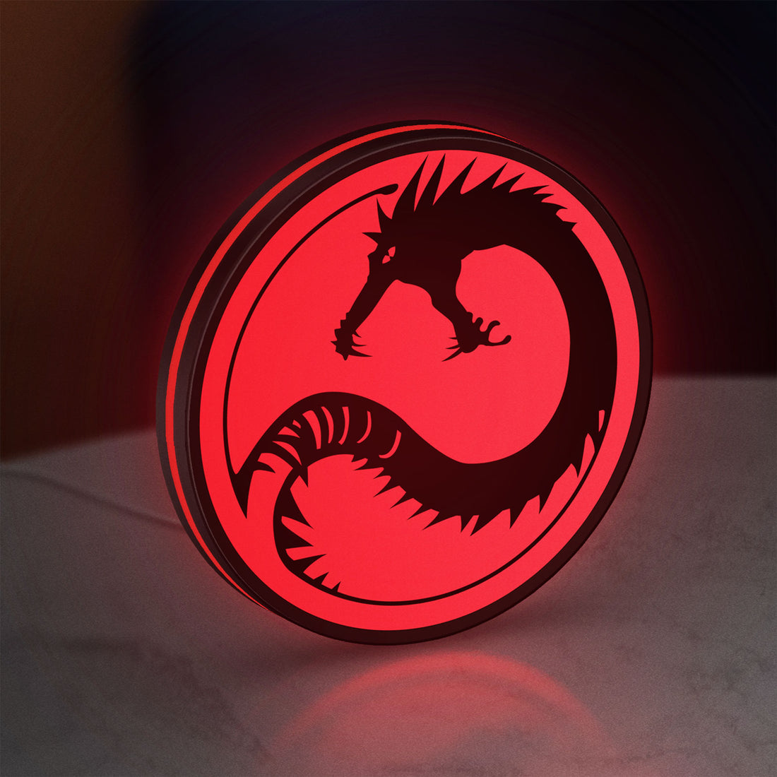 Battletech House Kurita LED lightbox hanging on a wall with red glow