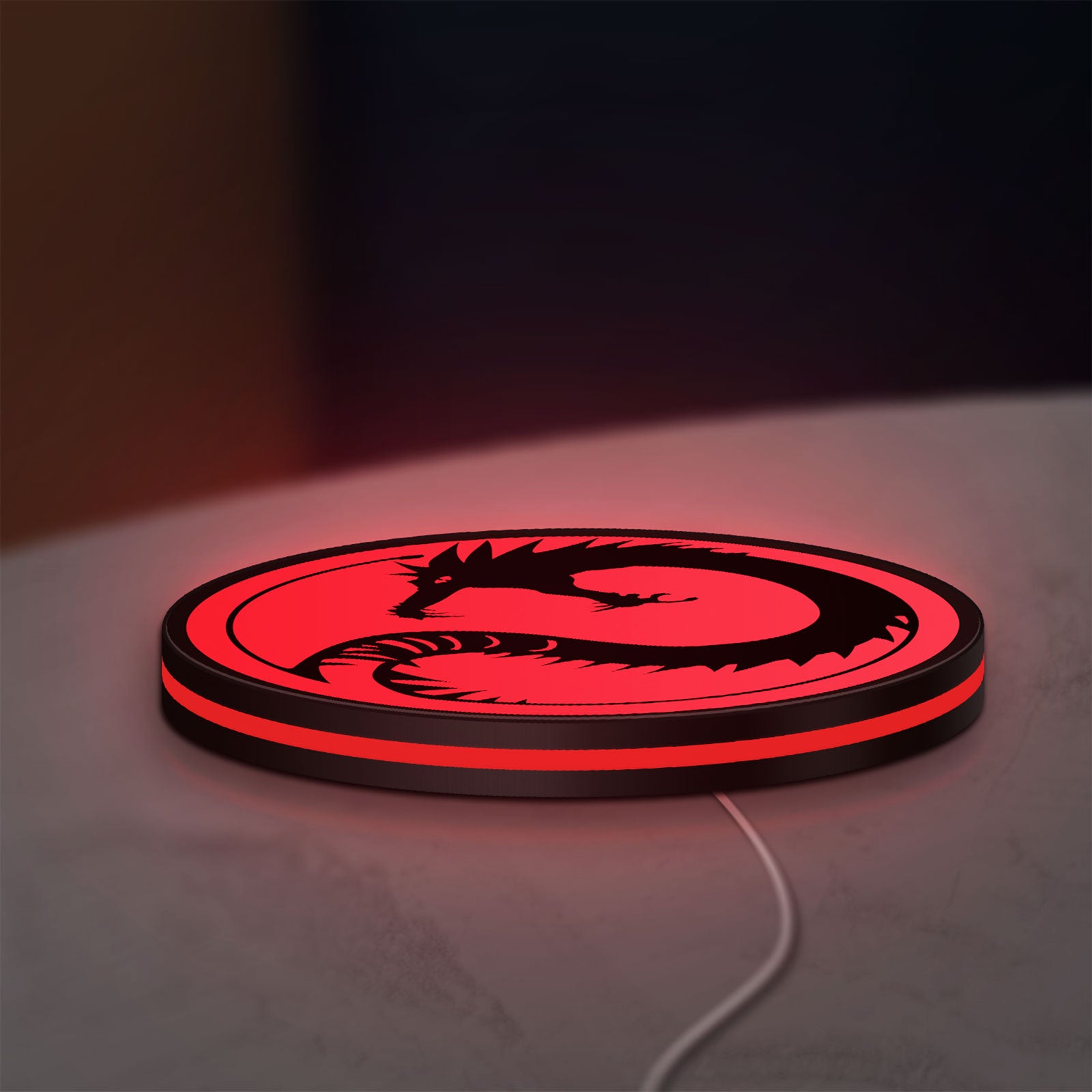Battletech House Kurita LED lightbox lying flat on a desk with red glow