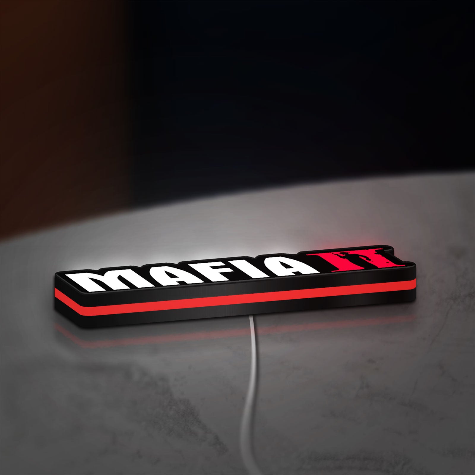 Mafia II LED lightbox lying flat on a desk with red glow