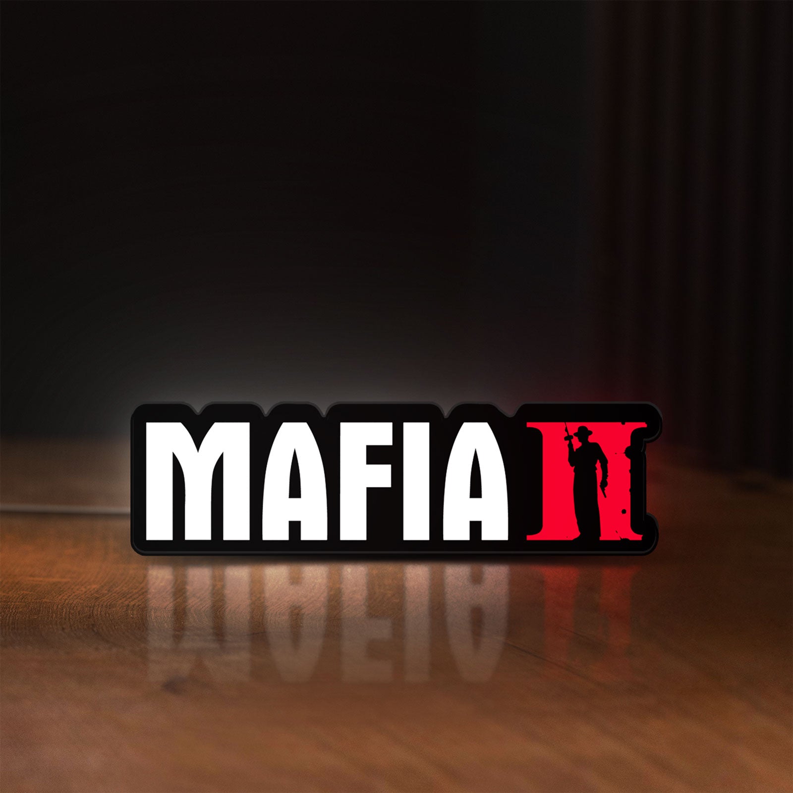 Front view of Mafia II LED lightbox sign glowing on a wooden desk