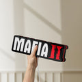 Unlit Mafia II LED lightbox held by hand to show size and details