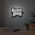 Guitar Hero LED lightbox hanging on a room wall with soft white light