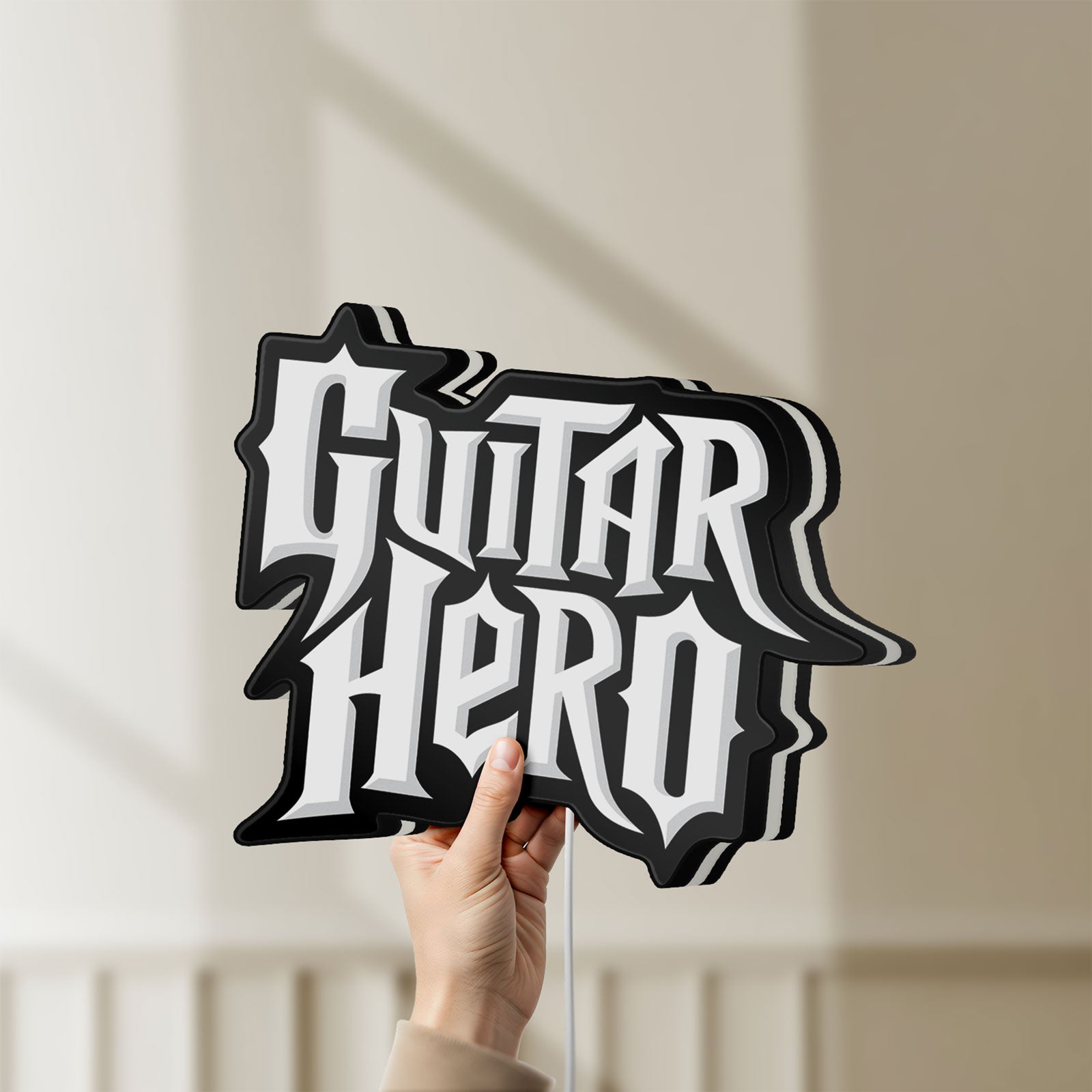 Unlit Guitar Hero LED lightbox held by hand to show size and details