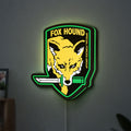 Fox Hound Special Forces LED lightbox hanging on a wall with green glow