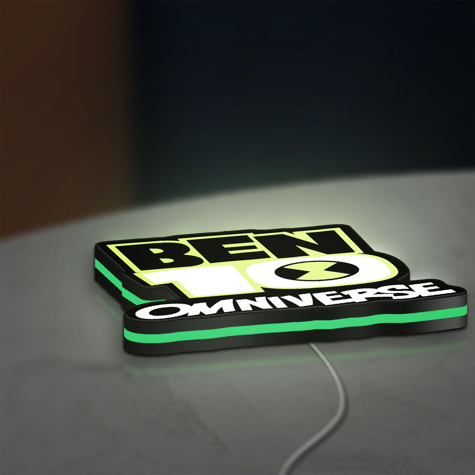 Ben 10 Omniverse LED lightbox lying flat on a desk with green glow