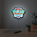 Paw Patrol LED lightbox hanging on a room wall with soft white light