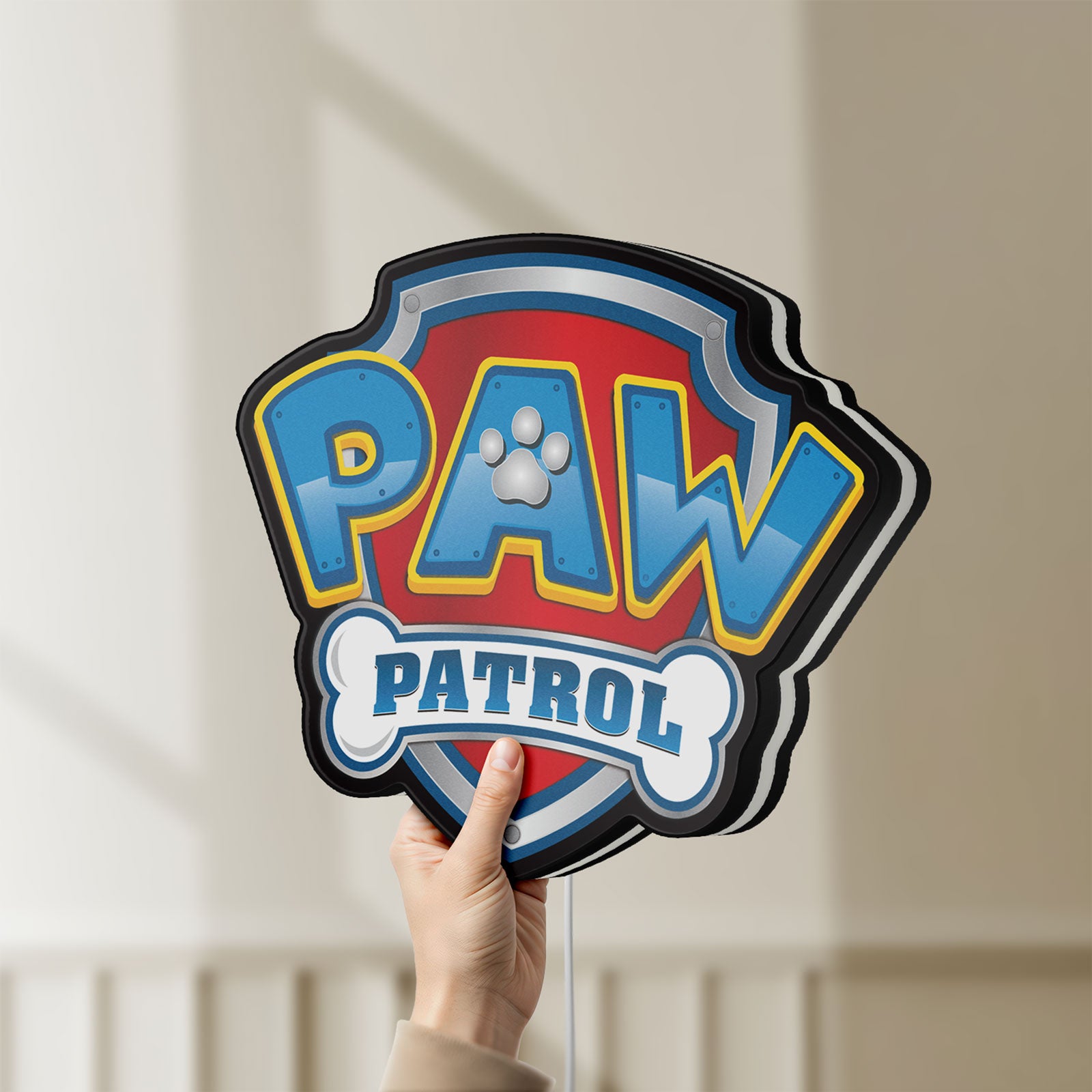 Unlit Paw Patrol LED lightbox held by hand to show size and details