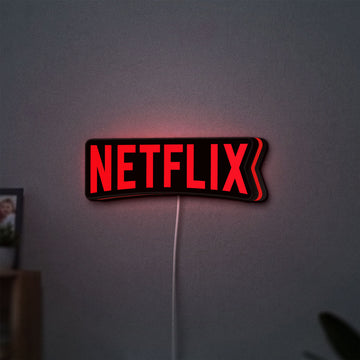 Netflix Style LED lightbox hanging on a wall with red glow