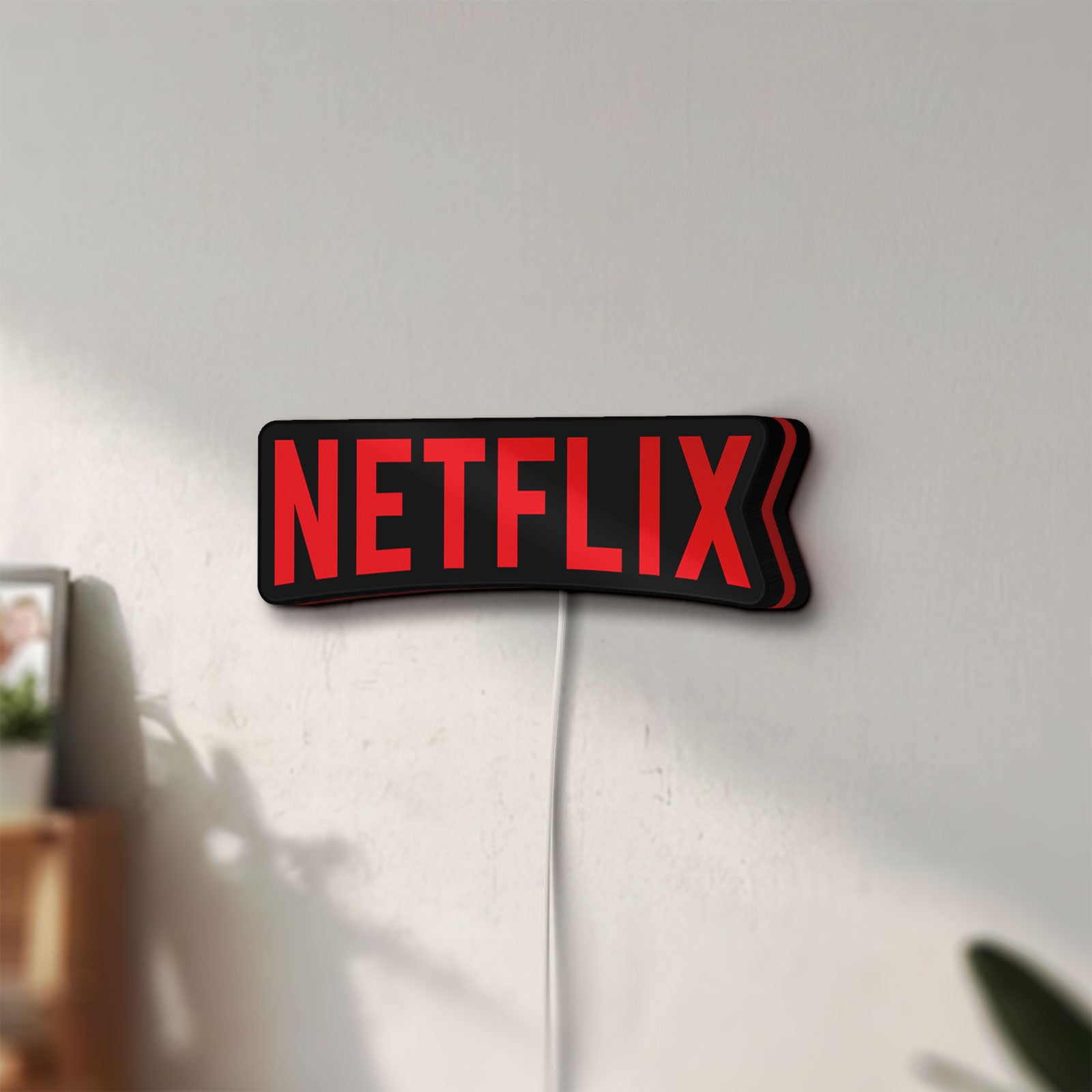 Unlit Netflix Style LED lightbox mounted on a wall in daylight