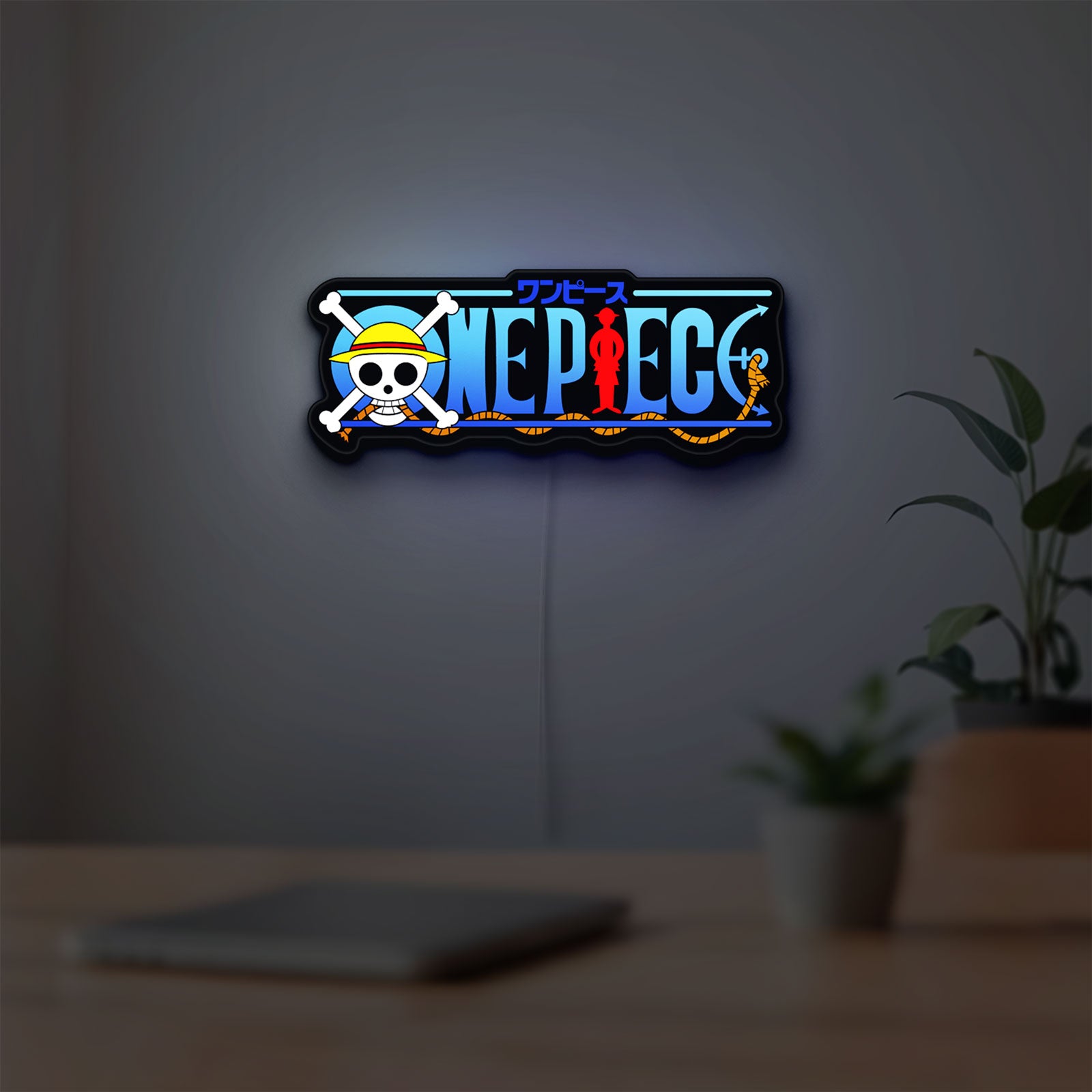 One Piece LED lightbox hanging on a room wall with soft blue light